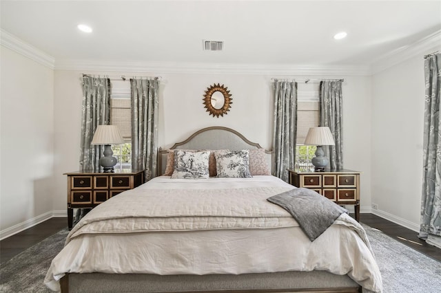 bedroom with visible vents, ornamental molding, baseboards, and dark wood-style flooring