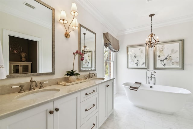 full bath with a freestanding tub, visible vents, a chandelier, and a sink