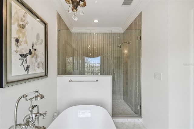 full bath featuring visible vents, a freestanding tub, a stall shower, crown molding, and marble finish floor