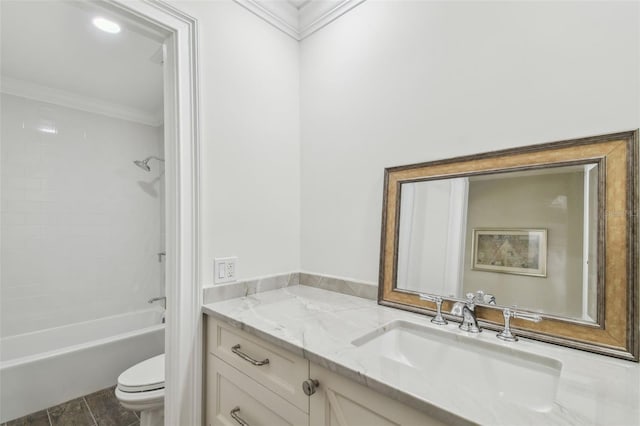 full bath with vanity, crown molding, toilet, and washtub / shower combination