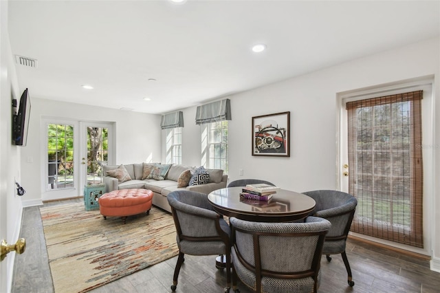 dining room featuring recessed lighting, wood finished floors, and visible vents