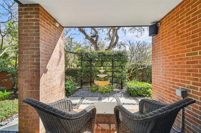 view of patio featuring fence