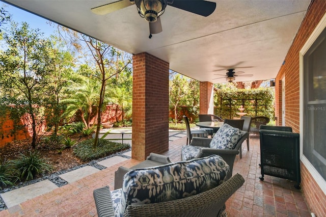 view of patio / terrace with outdoor lounge area, fence, and ceiling fan