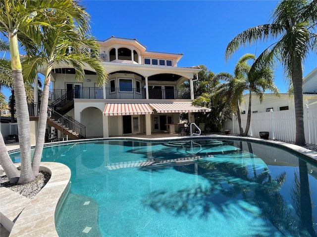view of swimming pool with a fenced in pool, a patio, stairs, and fence