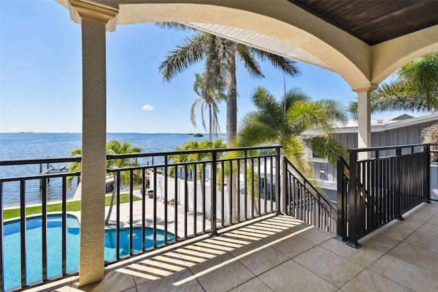 balcony featuring a water view