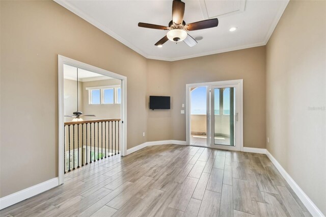 empty room with light wood-style flooring, baseboards, and ceiling fan