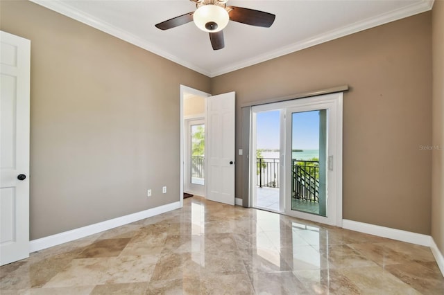 spare room with marble finish floor, a ceiling fan, baseboards, and ornamental molding