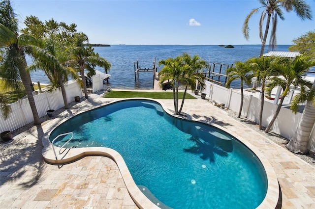 view of swimming pool with a patio area, a fenced in pool, a fenced backyard, and a water view