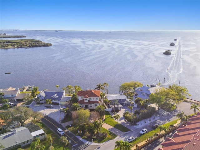 birds eye view of property with a residential view and a water view