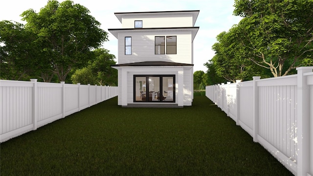 back of property with a lawn and a fenced backyard