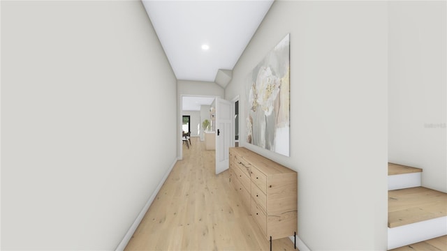 hallway with baseboards and light wood-type flooring