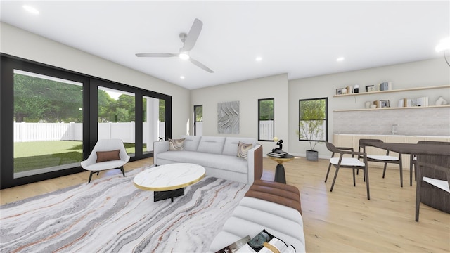 living area featuring light wood finished floors, recessed lighting, a ceiling fan, and baseboards