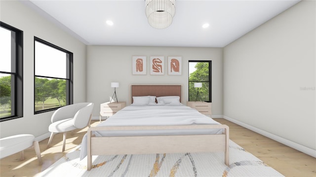 bedroom with recessed lighting, wood finished floors, and baseboards