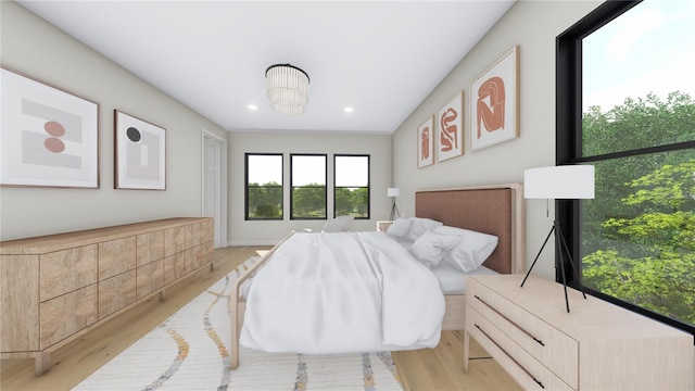 bedroom featuring recessed lighting and wood finished floors