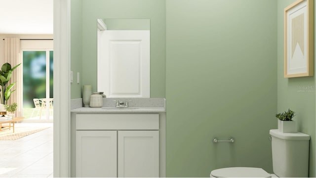 bathroom featuring toilet, vanity, and tile patterned flooring