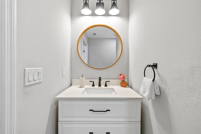 bathroom featuring vanity and visible vents