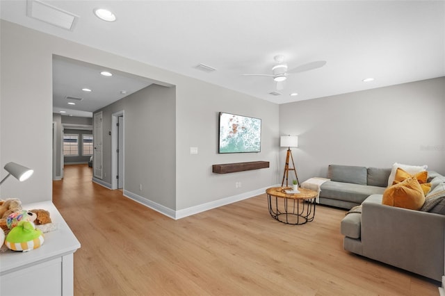 living area with visible vents, recessed lighting, and light wood-style floors