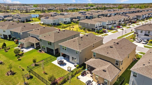 birds eye view of property with a residential view