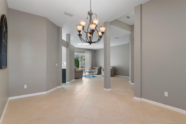 interior space featuring visible vents, baseboards, a notable chandelier, and light tile patterned flooring