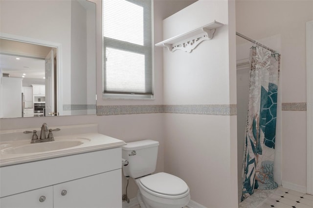 bathroom with a shower with shower curtain, toilet, and vanity