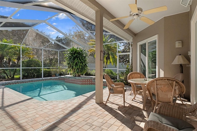 outdoor pool featuring ceiling fan, a lanai, outdoor dining space, and a patio area