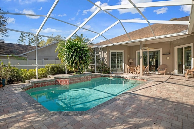 view of pool with a fenced in pool, fence, a patio area, an in ground hot tub, and a ceiling fan