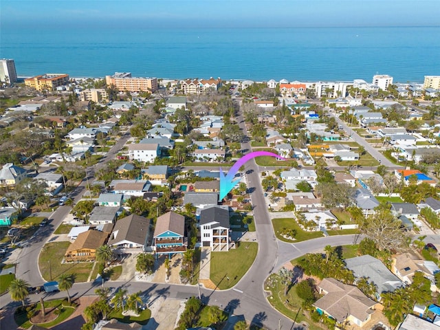 drone / aerial view with a residential view and a water view