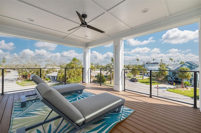 wooden deck featuring a ceiling fan