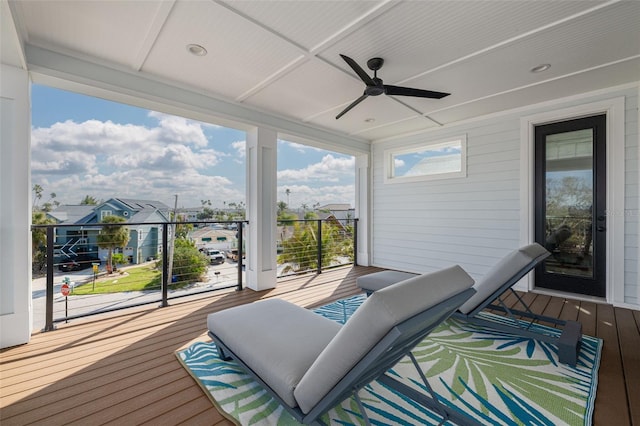 wooden terrace featuring a ceiling fan