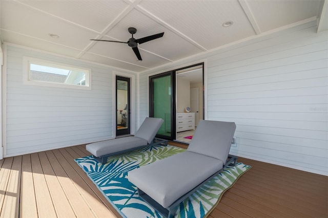 wooden terrace with a ceiling fan