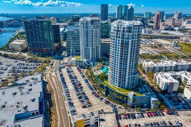 birds eye view of property with a water view and a city view