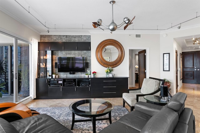 living room with visible vents, track lighting, and crown molding