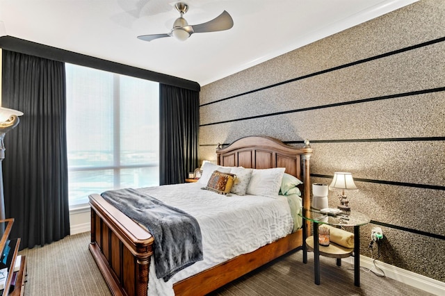 bedroom featuring ceiling fan and baseboards