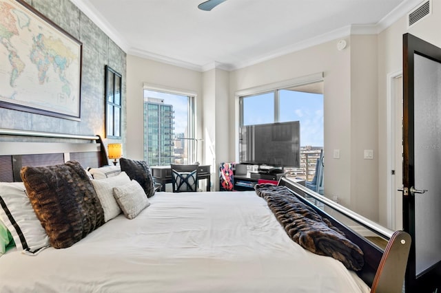 bedroom featuring crown molding, access to outside, and visible vents