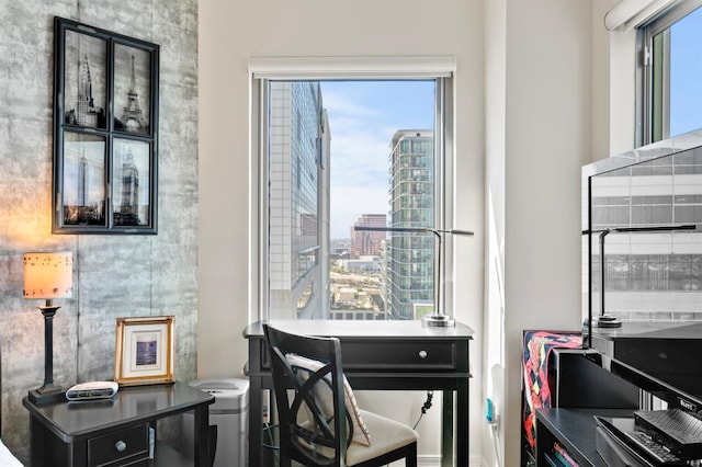 office space with a wealth of natural light and a city view