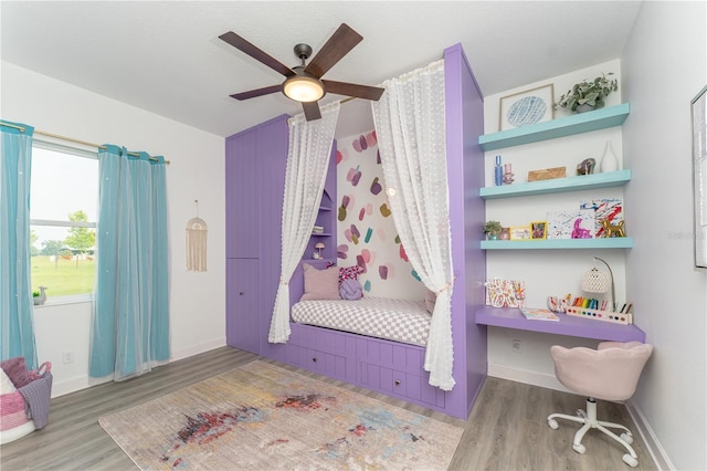 901 Eagle Ln, Apollo Beach, FL 33572 - bedroom with ceiling fan, baseboards, and wood finished floors