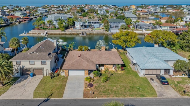 bird's eye view with a residential view and a water view