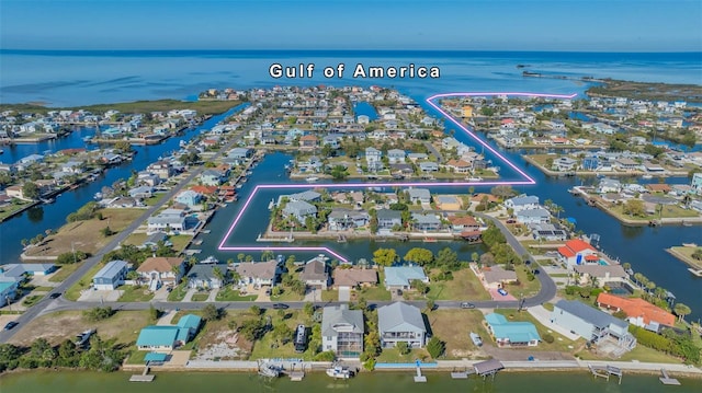 birds eye view of property featuring a residential view and a water view