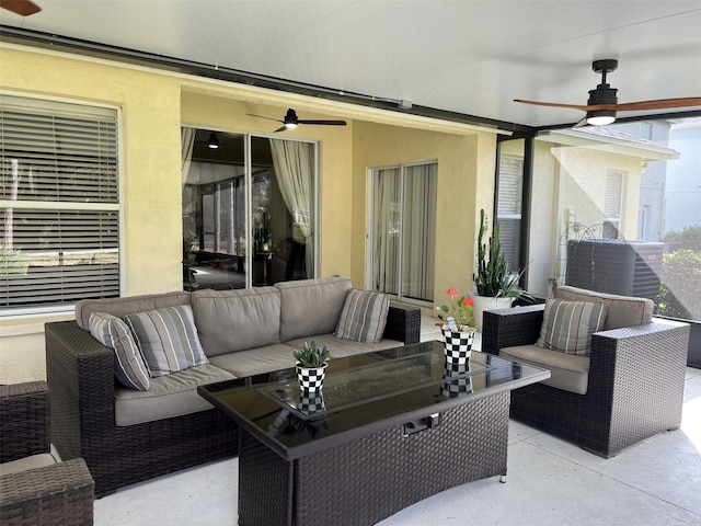 view of patio with an outdoor living space and a ceiling fan