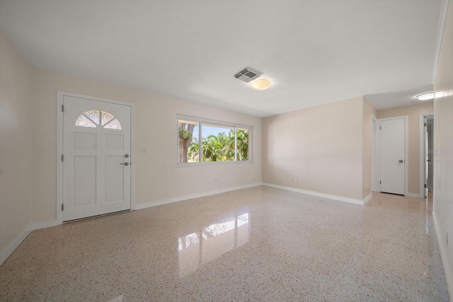 entryway featuring speckled floor, baseboards, and visible vents