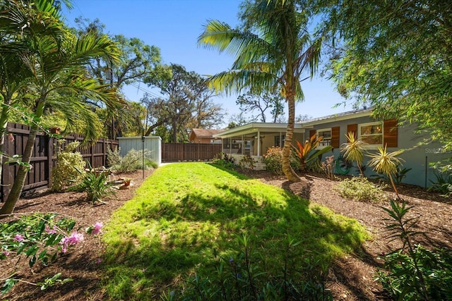 view of yard with a fenced backyard