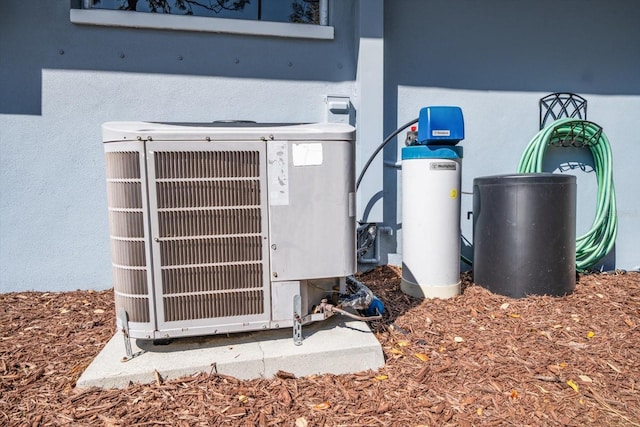 exterior details featuring stucco siding and cooling unit