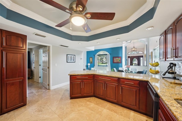 kitchen featuring stainless steel dishwasher, a raised ceiling, light stone counters, and visible vents