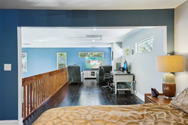 office area with attic access, wood finished floors, and baseboards