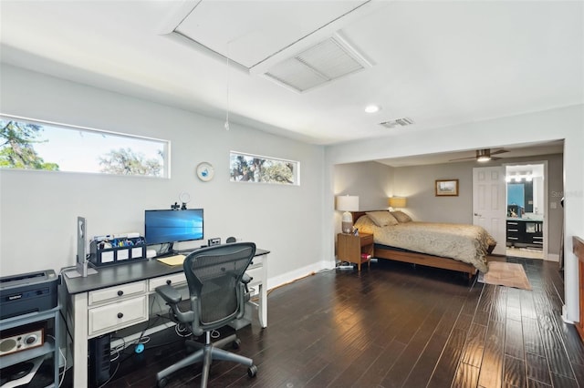 bedroom featuring attic access, visible vents, dark wood-type flooring, and baseboards