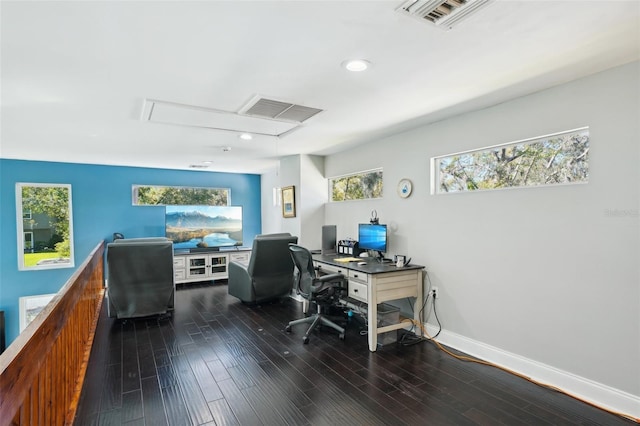 home office with visible vents, baseboards, and dark wood-style flooring