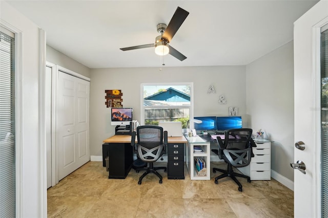 office with baseboards and ceiling fan