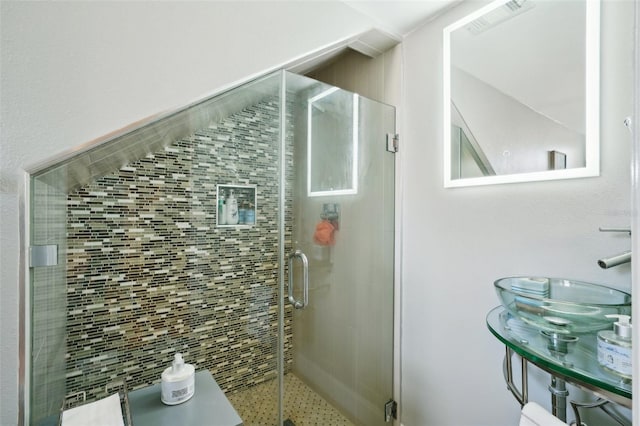 bathroom featuring visible vents and a shower stall