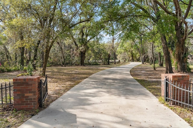 view of property's community featuring fence