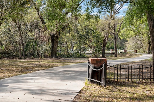 view of property's community with fence